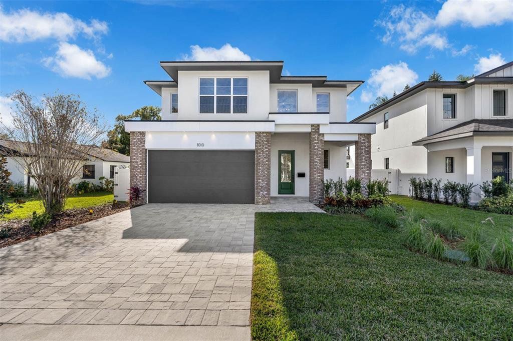 Front exterior of a new home in , Orlando, FL, highlighting curb appeal (Image 1). Front exterior of a new home in , Orlando, FL, highlighting curb appeal (Image 1).