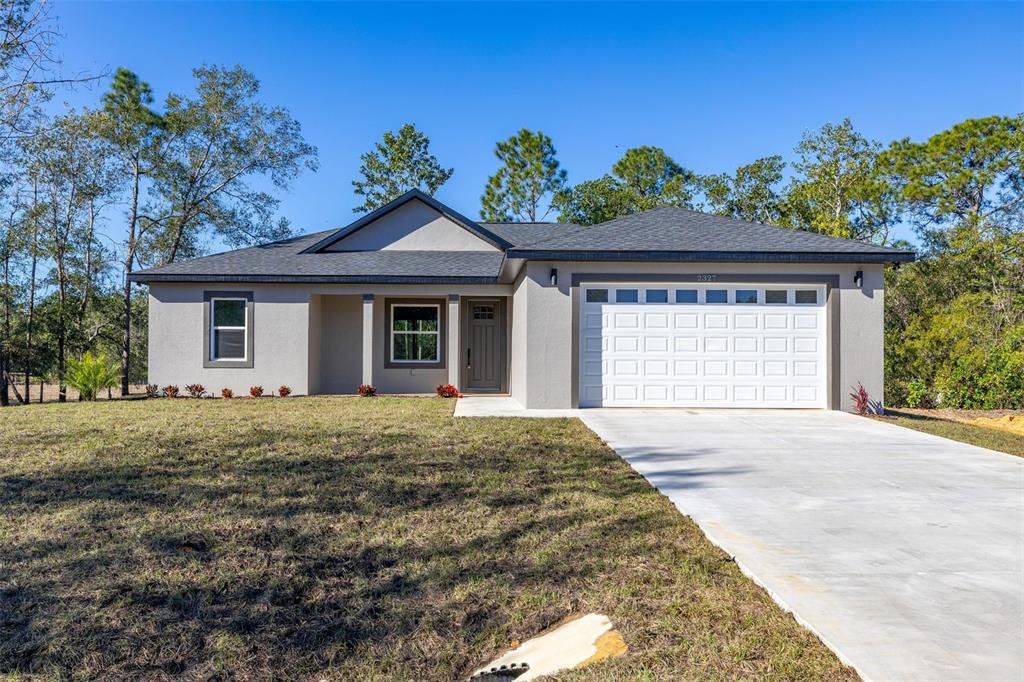 Front exterior of a new home in , Avon Park, FL, highlighting curb appeal (Image 1). Front exterior of a new home in , Avon Park, FL, highlighting curb appeal (Image 1).