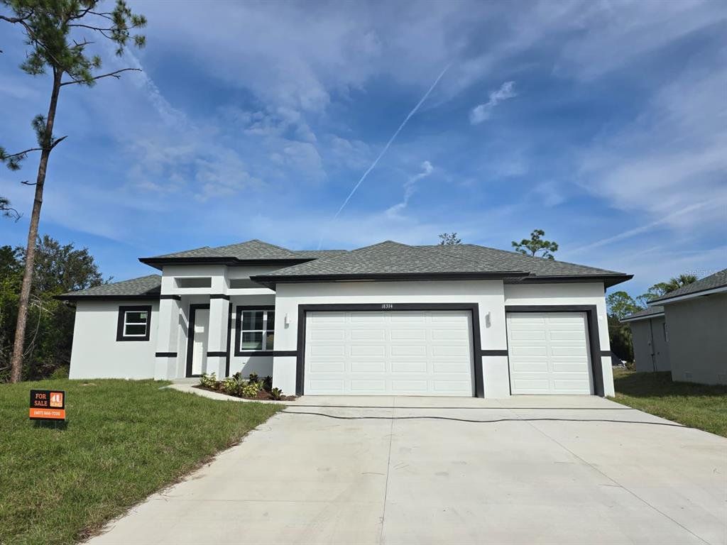 Front exterior of a new home in , Port Charlotte, FL, highlighting curb appeal (Image 1). Front exterior of a new home in , Port Charlotte, FL, highlighting curb appeal (Image 1).