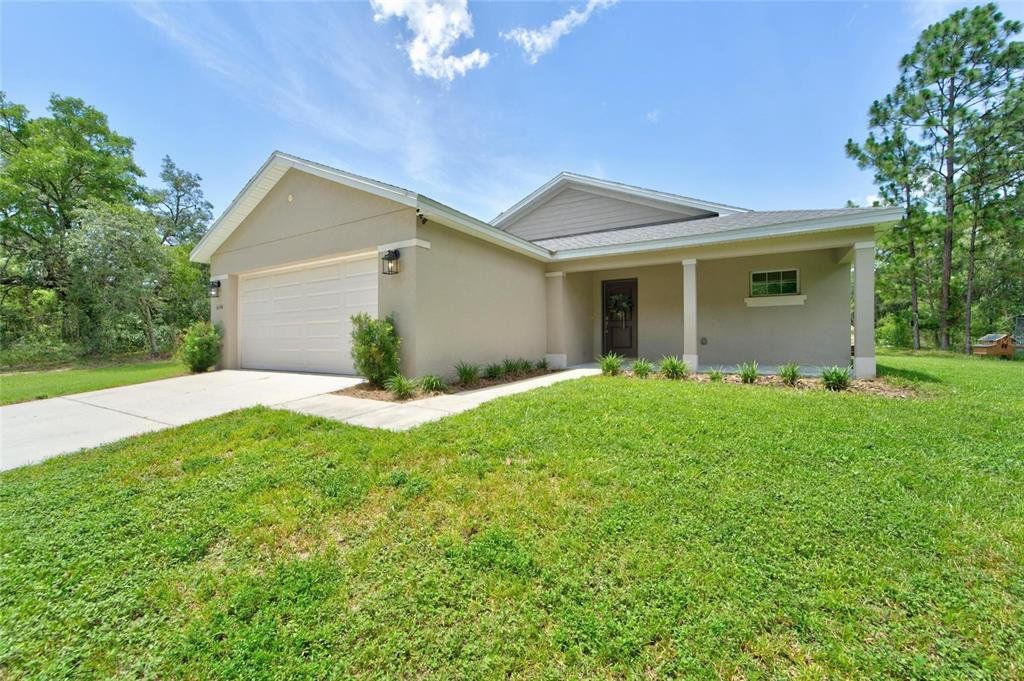 Front exterior of a new home in , Brooksville, FL, highlighting curb appeal (Image 1). Front exterior of a new home in , Brooksville, FL, highlighting curb appeal (Image 1).