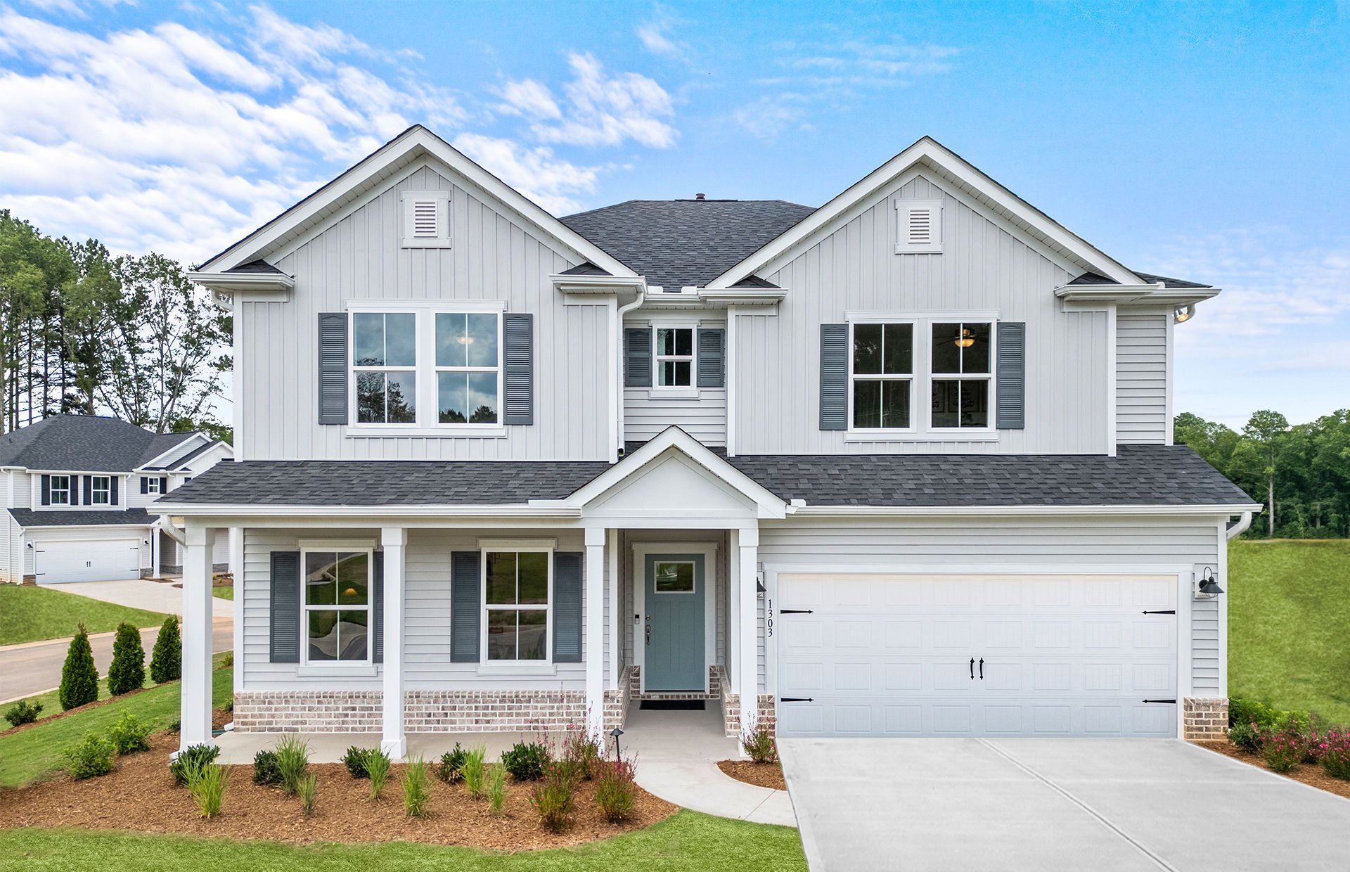Front exterior of a new home in Briarwood Reserve, Spartanburg, SC, highlighting curb appeal (Image 1). Front exterior of a new home in Briarwood Reserve, Spartanburg, SC, highlighting curb appeal (Image 1).