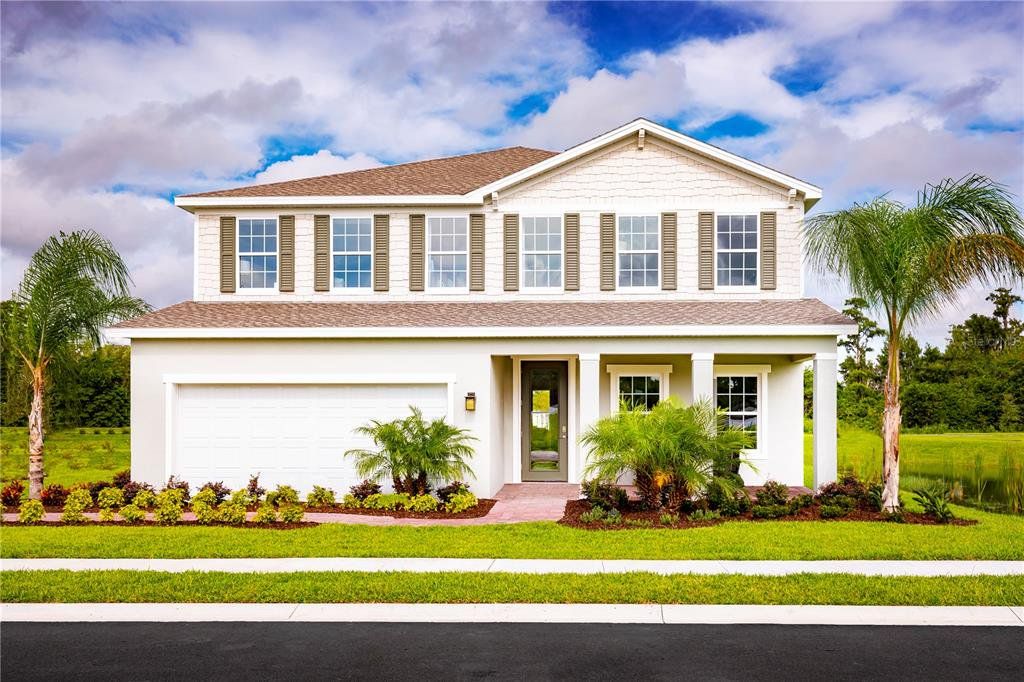 Front exterior of a new home in The Crossings, St. Cloud, FL, highlighting curb appeal (Image 1). Front exterior of a new home in The Crossings, St. Cloud, FL, highlighting curb appeal (Image 1).
