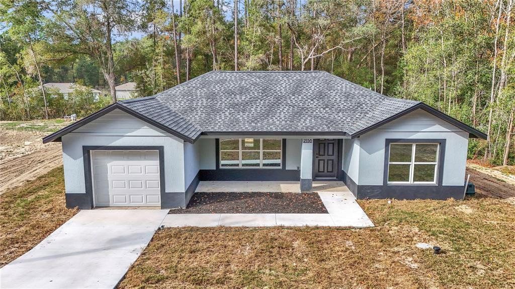 Front exterior of a new home in , Ocala, FL, highlighting curb appeal (Image 1). Front exterior of a new home in , Ocala, FL, highlighting curb appeal (Image 1).
