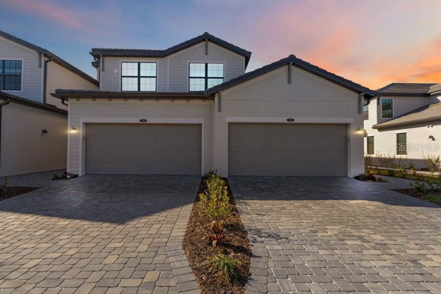 Front exterior of a new home in Legends Cove, Bradenton, FL, highlighting curb appeal (Image 1). Front exterior of a new home in Legends Cove, Bradenton, FL, highlighting curb appeal (Image 1).