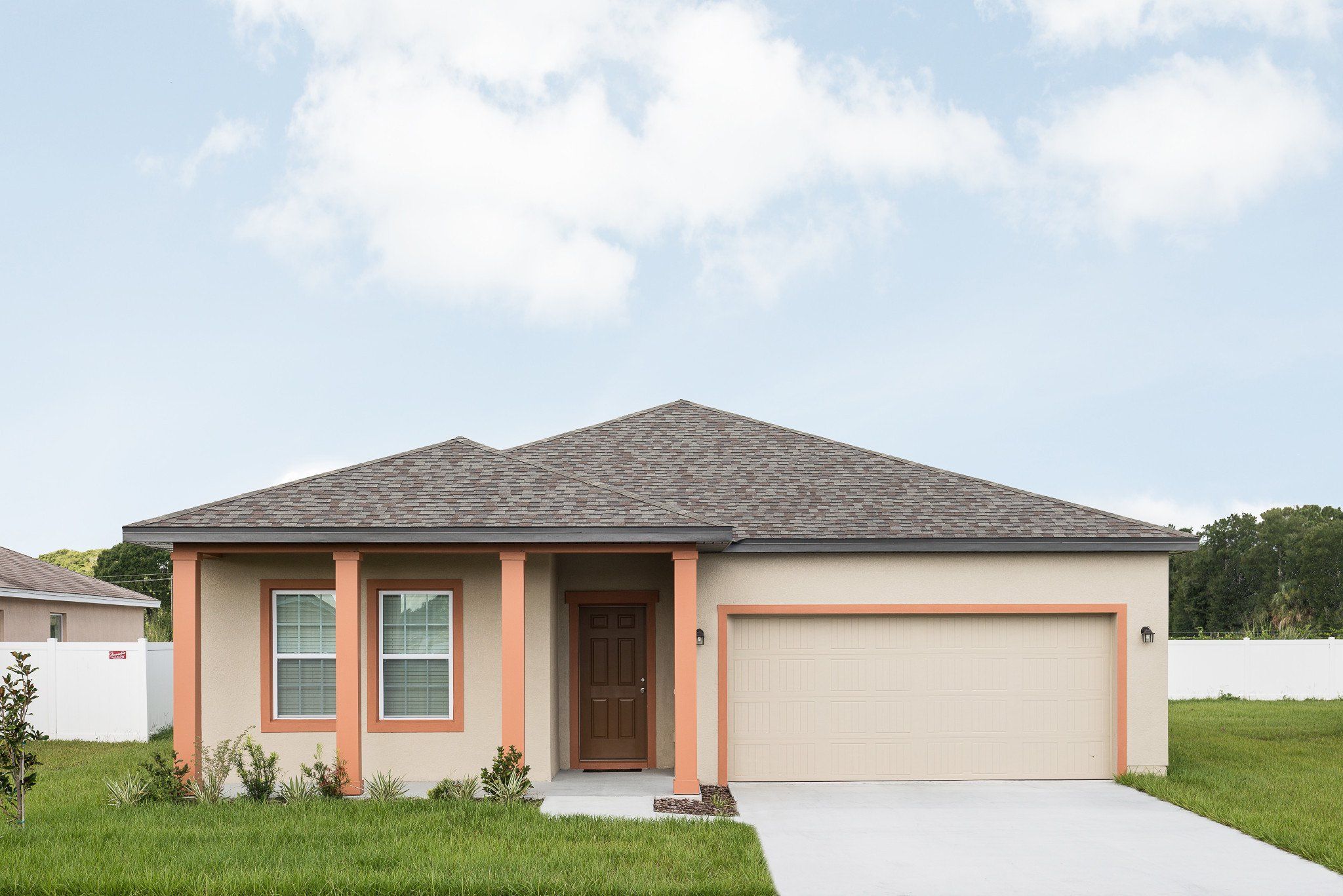 Front exterior of a new home in Hawks Run, Kissimmee, FL, highlighting curb appeal (Image 1). Front exterior of a new home in Hawks Run, Kissimmee, FL, highlighting curb appeal (Image 1).