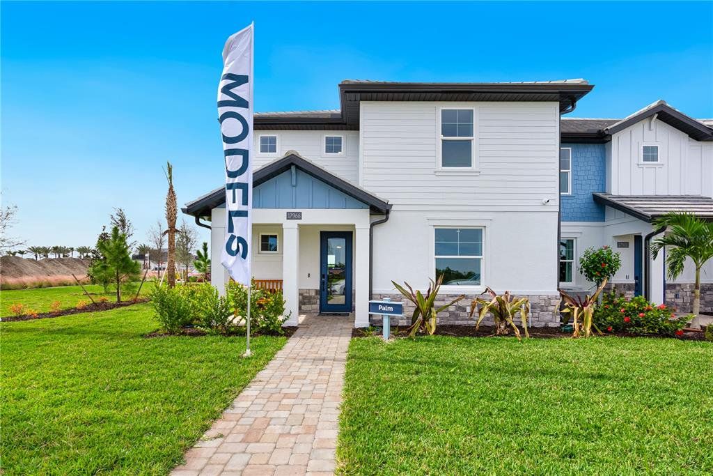 Front exterior of a new home in Palmera at Wellen Park, Venice, FL, highlighting curb appeal (Image 1). Front exterior of a new home in Palmera at Wellen Park, Venice, FL, highlighting curb appeal (Image 1).