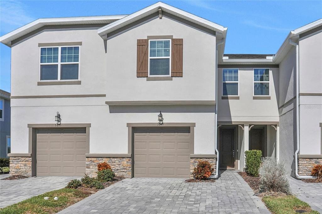 Front exterior of a new home in Chapel Crossings, Wesley Chapel, FL, highlighting curb appeal (Image 1). Front exterior of a new home in Chapel Crossings, Wesley Chapel, FL, highlighting curb appeal (Image 1).