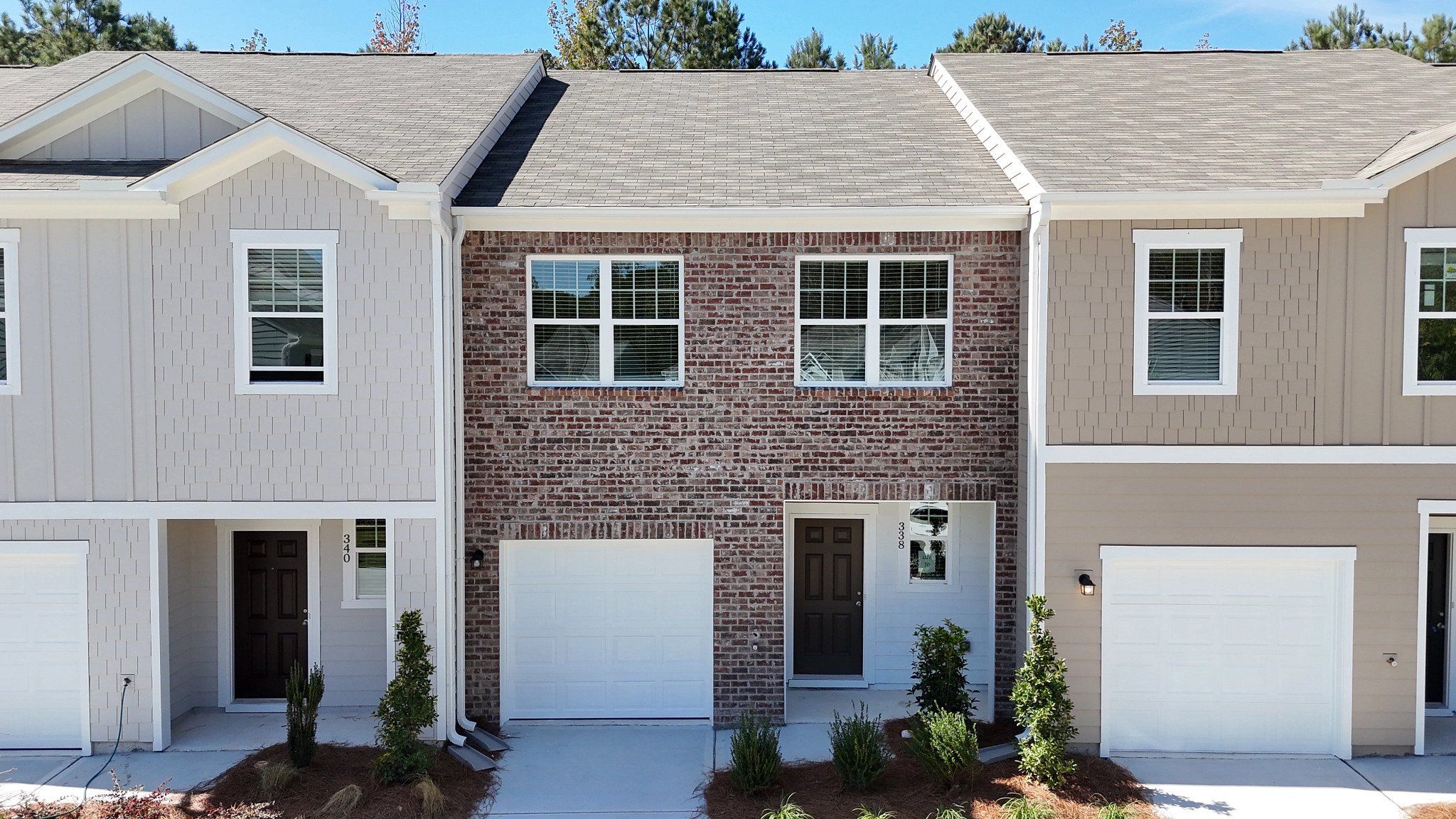 Front exterior of a new home in Rivington Walk, Winder, GA, highlighting curb appeal (Image 1).