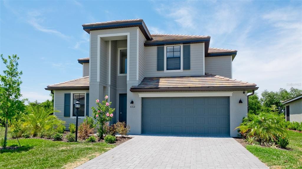 Front exterior of a new home in , Bradenton, FL, highlighting curb appeal (Image 1). Front exterior of a new home in , Bradenton, FL, highlighting curb appeal (Image 1).
