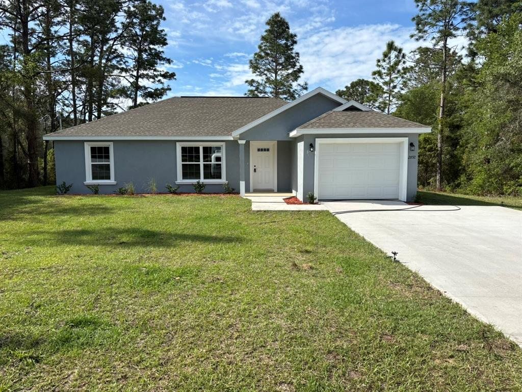 Front exterior of a new home in , Dunnellon, FL, highlighting curb appeal (Image 1). Front exterior of a new home in , Dunnellon, FL, highlighting curb appeal (Image 1).