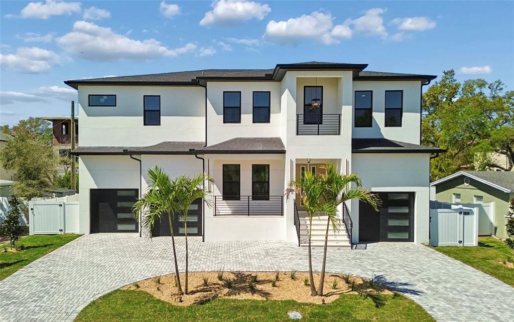 Front exterior of a new home in , Tampa, FL, highlighting curb appeal (Image 1). Front exterior of a new home in , Tampa, FL, highlighting curb appeal (Image 1).