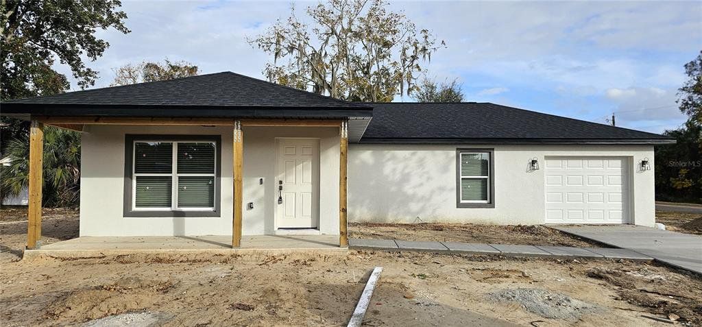 Front exterior of a new home in , Ocala, FL, highlighting curb appeal (Image 1). Front exterior of a new home in , Ocala, FL, highlighting curb appeal (Image 1).