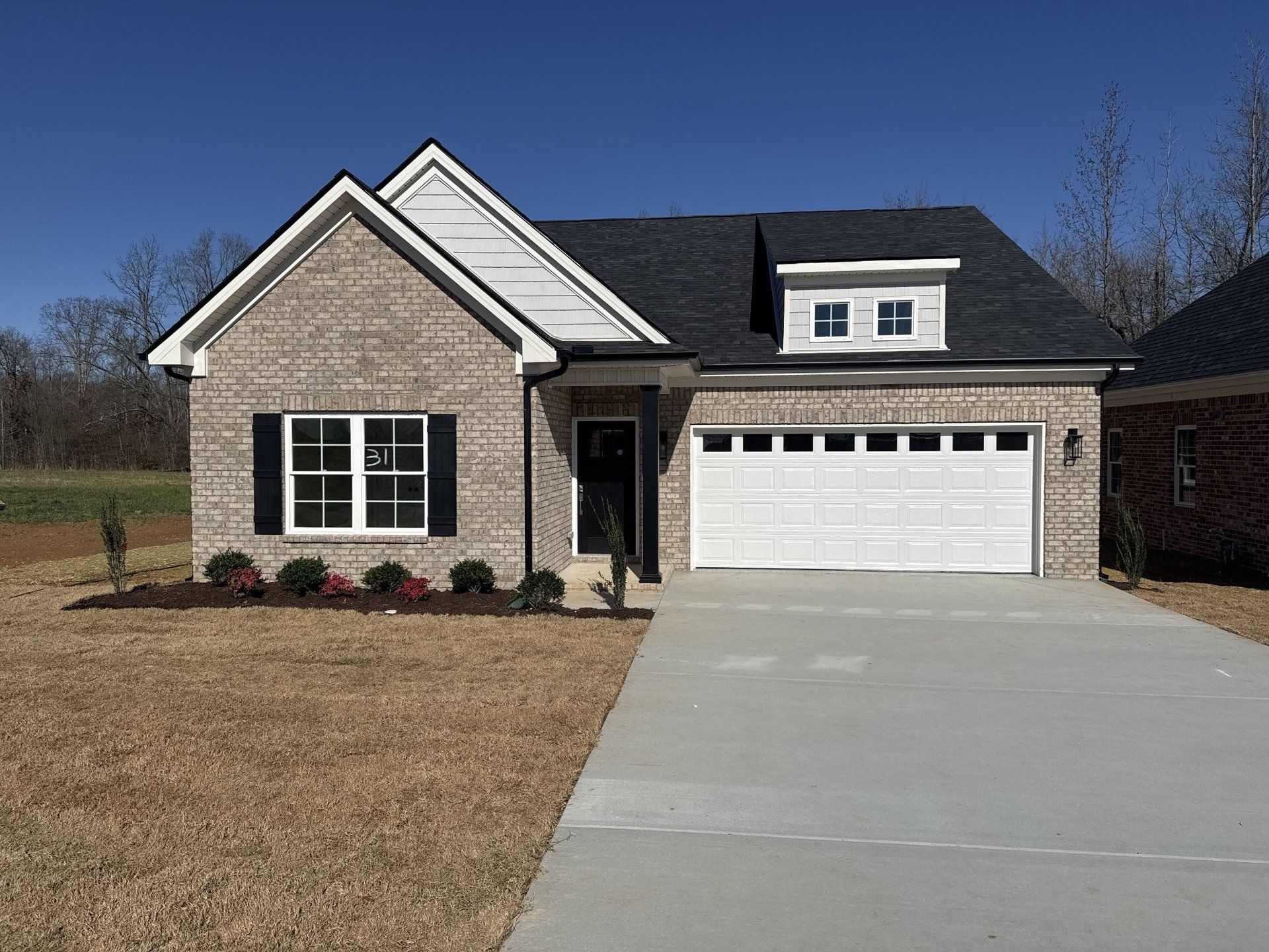 Front exterior of a new home in Legacy Preserve, Tullahoma, TN, highlighting curb appeal (Image 1). Front exterior of a new home in Legacy Preserve, Tullahoma, TN, highlighting curb appeal (Image 1).
