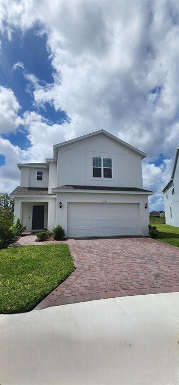 Front exterior of a new home in Preservation Pointe, Davenport, FL, highlighting curb appeal (Image 1). Front exterior of a new home in Preservation Pointe, Davenport, FL, highlighting curb appeal (Image 1).