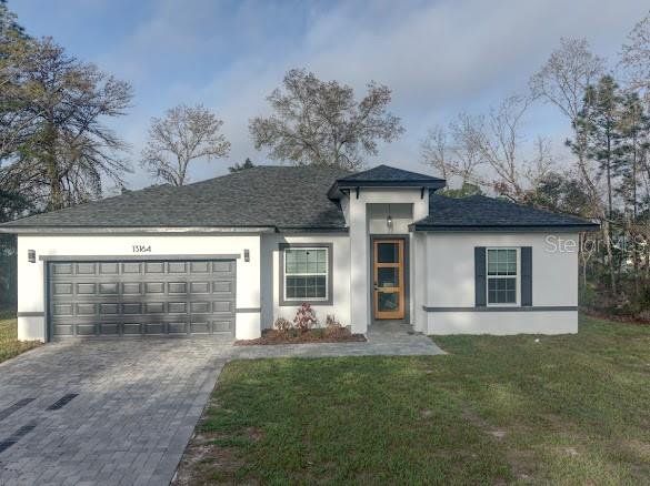 Front exterior of a new home in , Ocala, FL, highlighting curb appeal (Image 1). Front exterior of a new home in , Ocala, FL, highlighting curb appeal (Image 1).