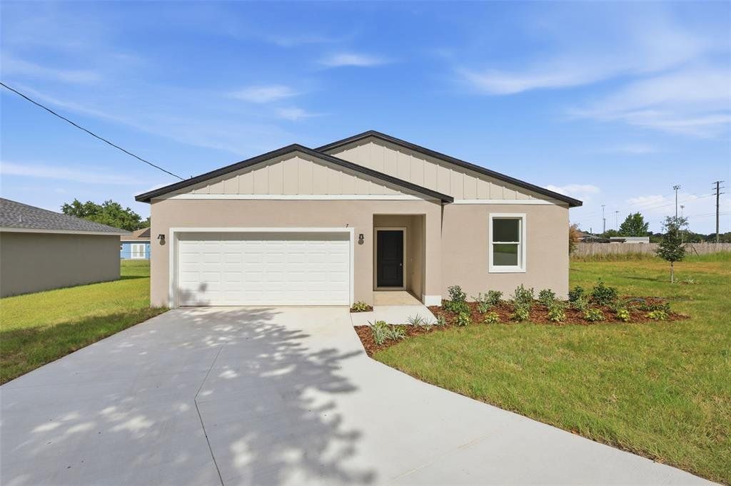 Front exterior of a new home in , Ocala, FL, highlighting curb appeal (Image 1). Front exterior of a new home in , Ocala, FL, highlighting curb appeal (Image 1).