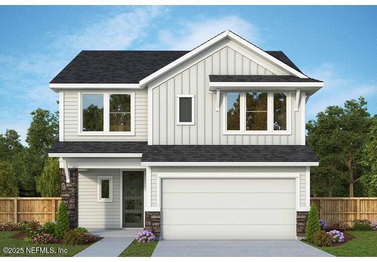 Front exterior of a new home in Evergreen Island at Silverleaf - Classic, St. Augustine, FL, highlighting curb appeal (Image 1). Front exterior of a new home in Evergreen Island at Silverleaf - Classic, St. Augustine, FL, highlighting curb appeal (Image 1).