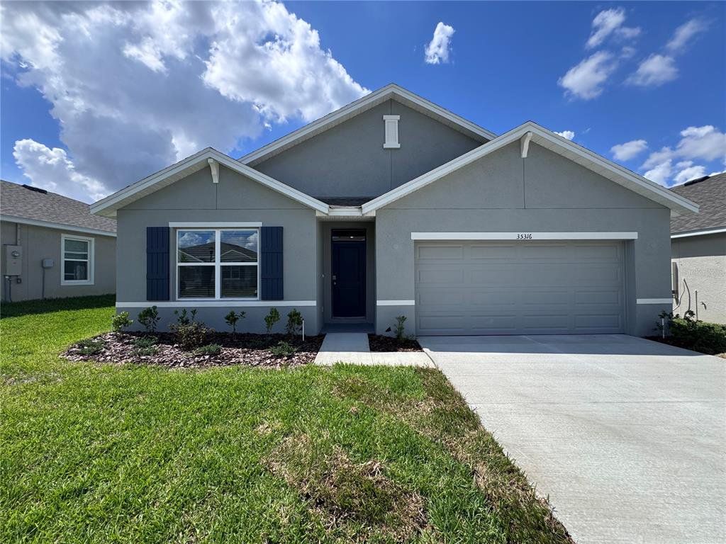 Front exterior of a new home in , Dade City, FL, highlighting curb appeal (Image 1). Front exterior of a new home in , Dade City, FL, highlighting curb appeal (Image 1).