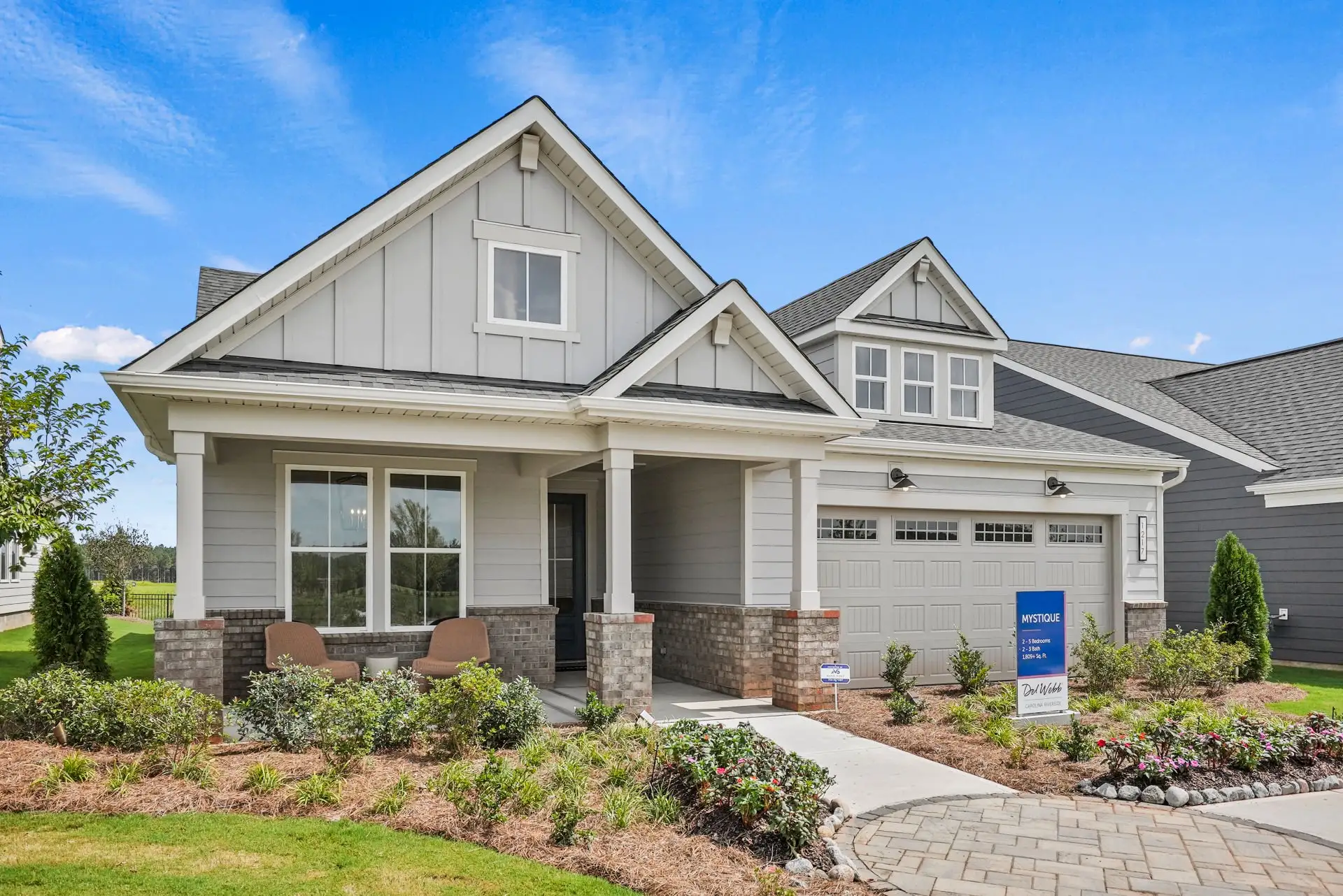 Front exterior of a new home in Carolina Riverside, Belmont, NC, highlighting curb appeal (Image 1). Front exterior of a new home in Carolina Riverside, Belmont, NC, highlighting curb appeal (Image 1).