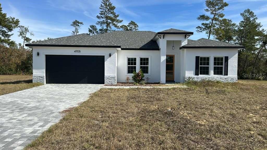 Front exterior of a new home in , Ocala, FL, highlighting curb appeal (Image 1). Front exterior of a new home in , Ocala, FL, highlighting curb appeal (Image 1).
