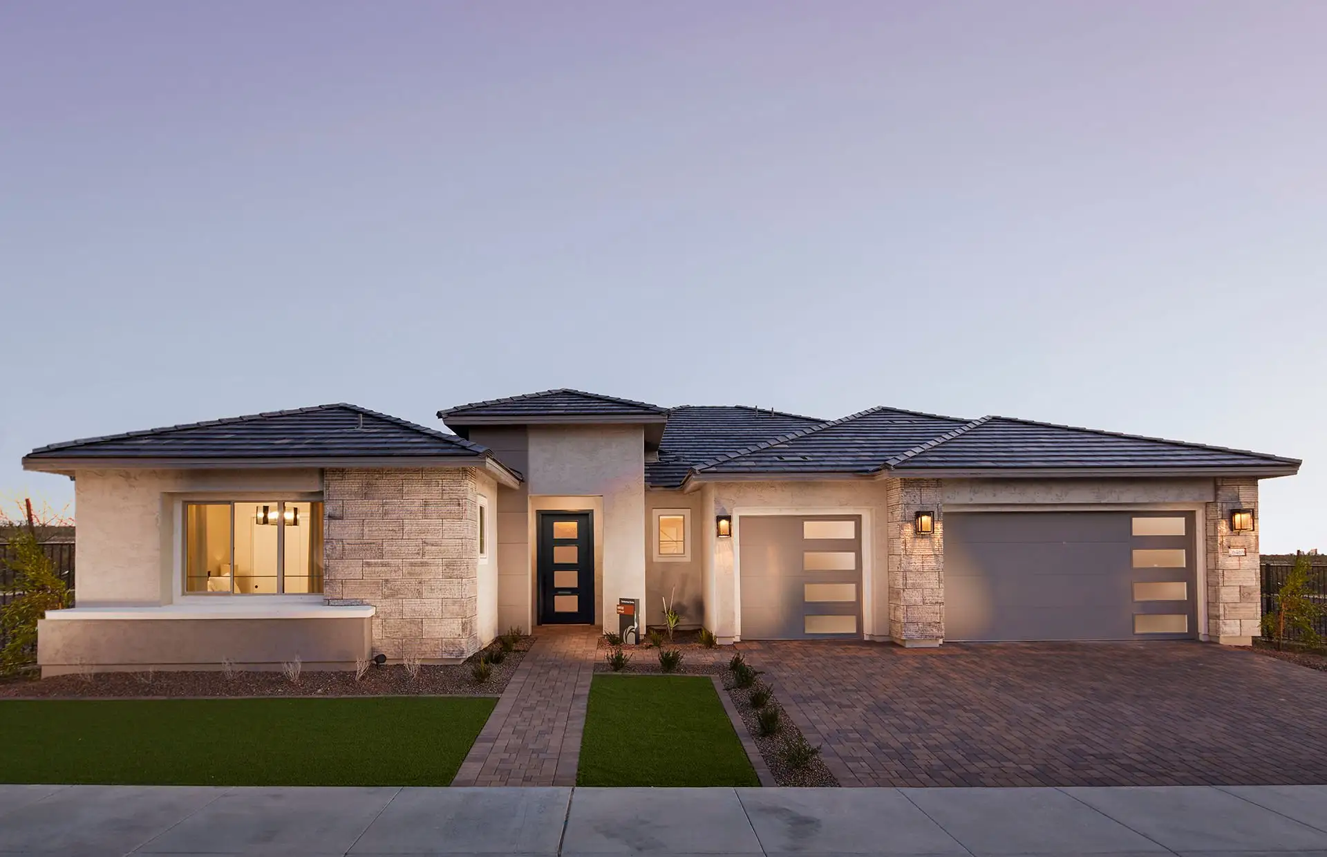 Front exterior of a new home in Sun City Festival, Buckeye, AZ, highlighting curb appeal (Image 1).