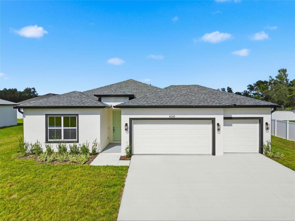 Front exterior of a new home in , Ocala, FL, highlighting curb appeal (Image 1). Front exterior of a new home in , Ocala, FL, highlighting curb appeal (Image 1).