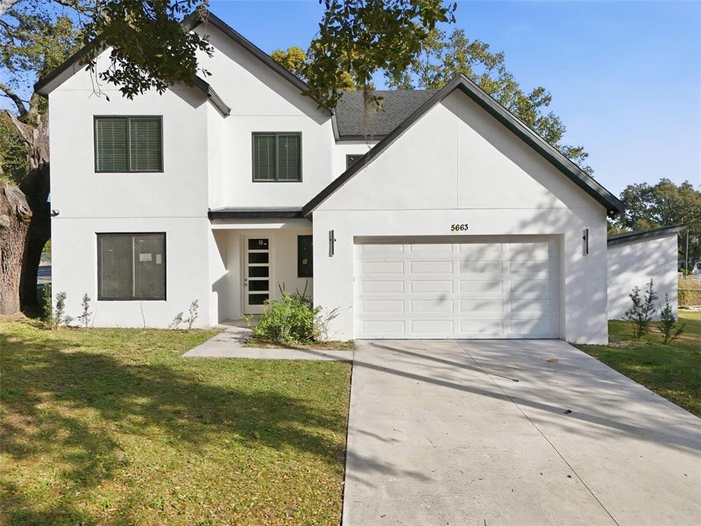 Front exterior of a new home in , Orlando, FL, highlighting curb appeal (Image 1). Front exterior of a new home in , Orlando, FL, highlighting curb appeal (Image 1).
