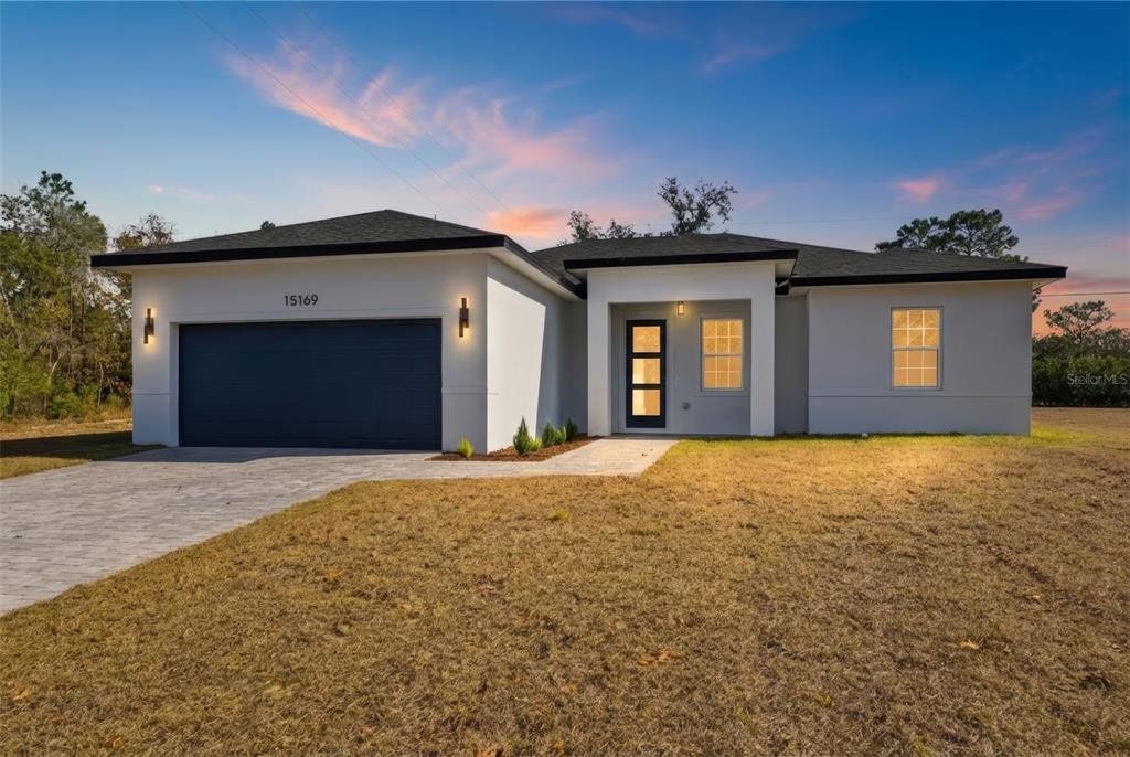 Front exterior of a new home in , Ocala, FL, highlighting curb appeal (Image 1). Front exterior of a new home in , Ocala, FL, highlighting curb appeal (Image 1).