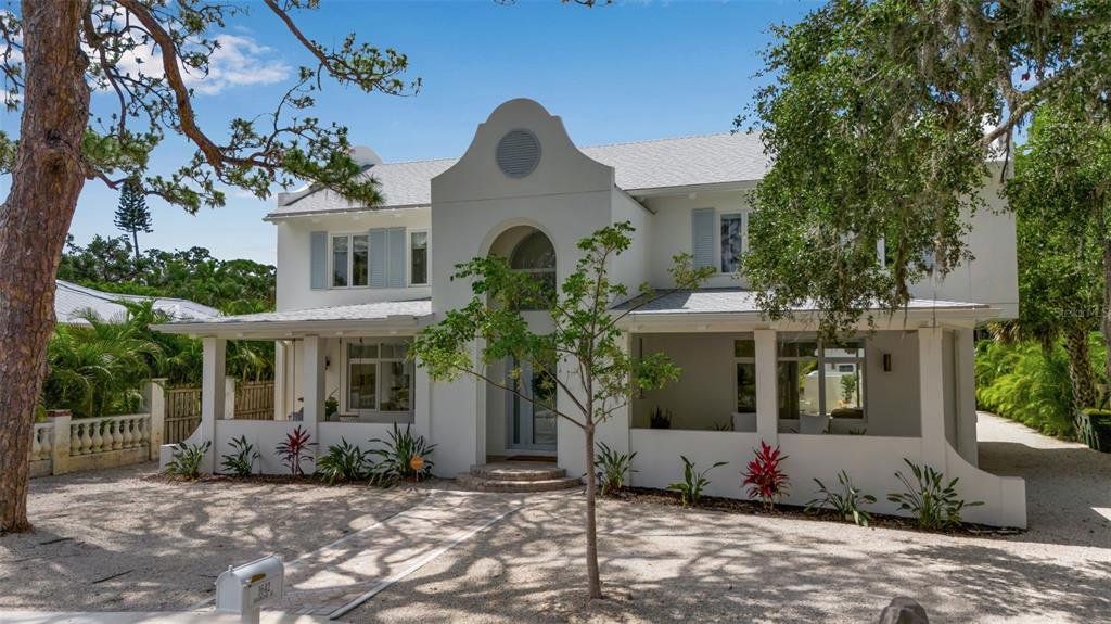 Front exterior of a new home in , Sarasota, FL, highlighting curb appeal (Image 1). Front exterior of a new home in , Sarasota, FL, highlighting curb appeal (Image 1).
