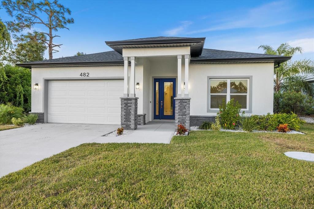 Front exterior of a new home in , Rotonda West, FL, highlighting curb appeal (Image 1). Front exterior of a new home in , Rotonda West, FL, highlighting curb appeal (Image 1).