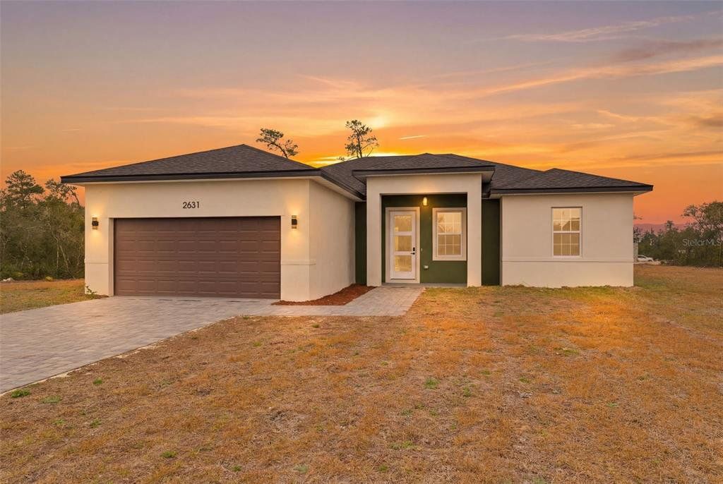 Front exterior of a new home in , Ocala, FL, highlighting curb appeal (Image 1). Front exterior of a new home in , Ocala, FL, highlighting curb appeal (Image 1).