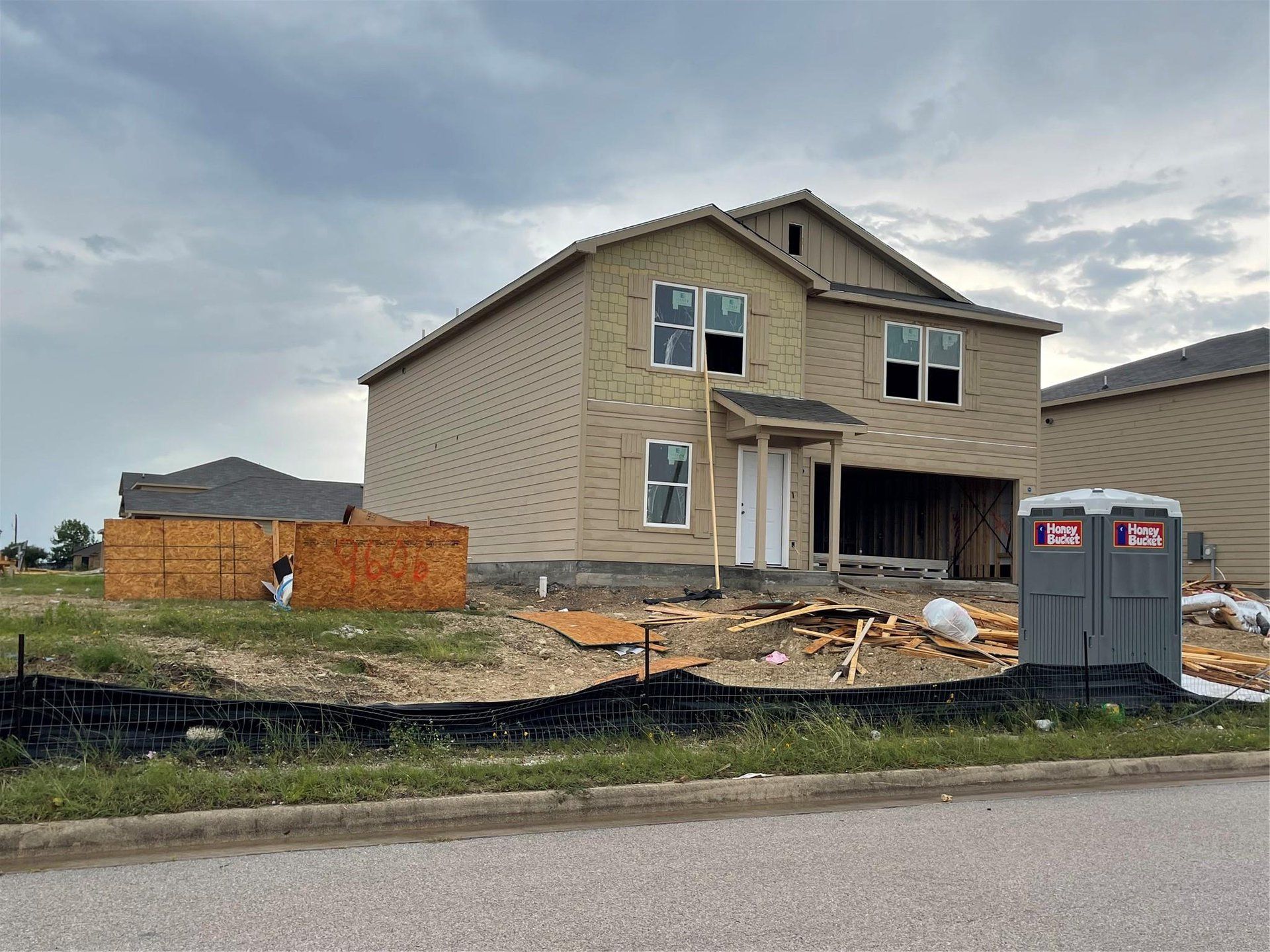 View of front of home featuring an attached garage View of front of home featuring an attached garage