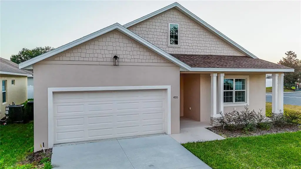 Front exterior of a new home in , Ocala, FL, highlighting curb appeal (Image 1). Front exterior of a new home in , Ocala, FL, highlighting curb appeal (Image 1).