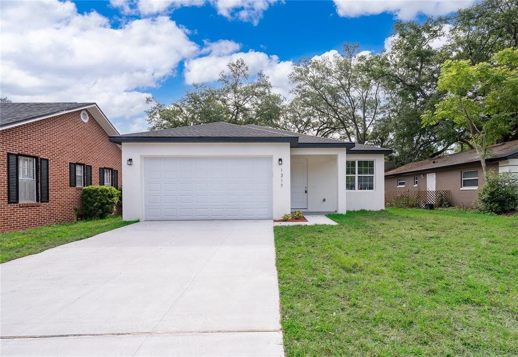 Front exterior of a new home in , Sanford, FL, highlighting curb appeal (Image 1). Front exterior of a new home in , Sanford, FL, highlighting curb appeal (Image 1).