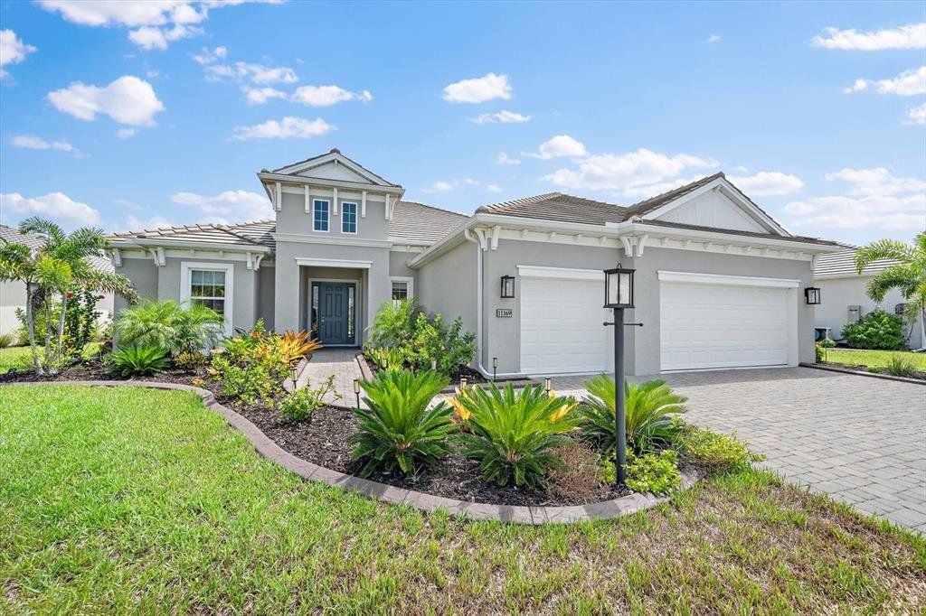 Front exterior of a new home in , Englewood, FL, highlighting curb appeal (Image 1). Front exterior of a new home in , Englewood, FL, highlighting curb appeal (Image 1).