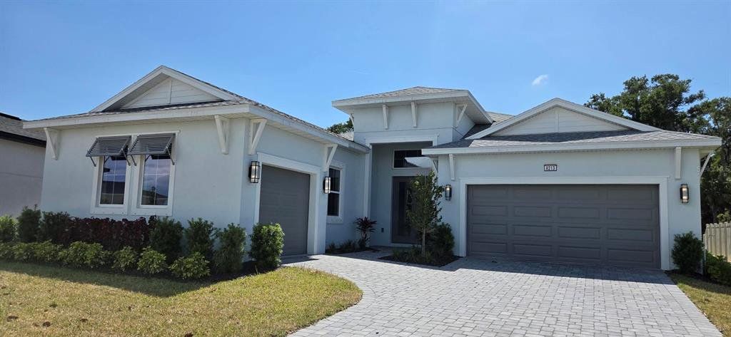 Front exterior of a new home in Biscayne Landing at Seaire, Parrish, FL, highlighting curb appeal (Image 1). Front exterior of a new home in Biscayne Landing at Seaire, Parrish, FL, highlighting curb appeal (Image 1).