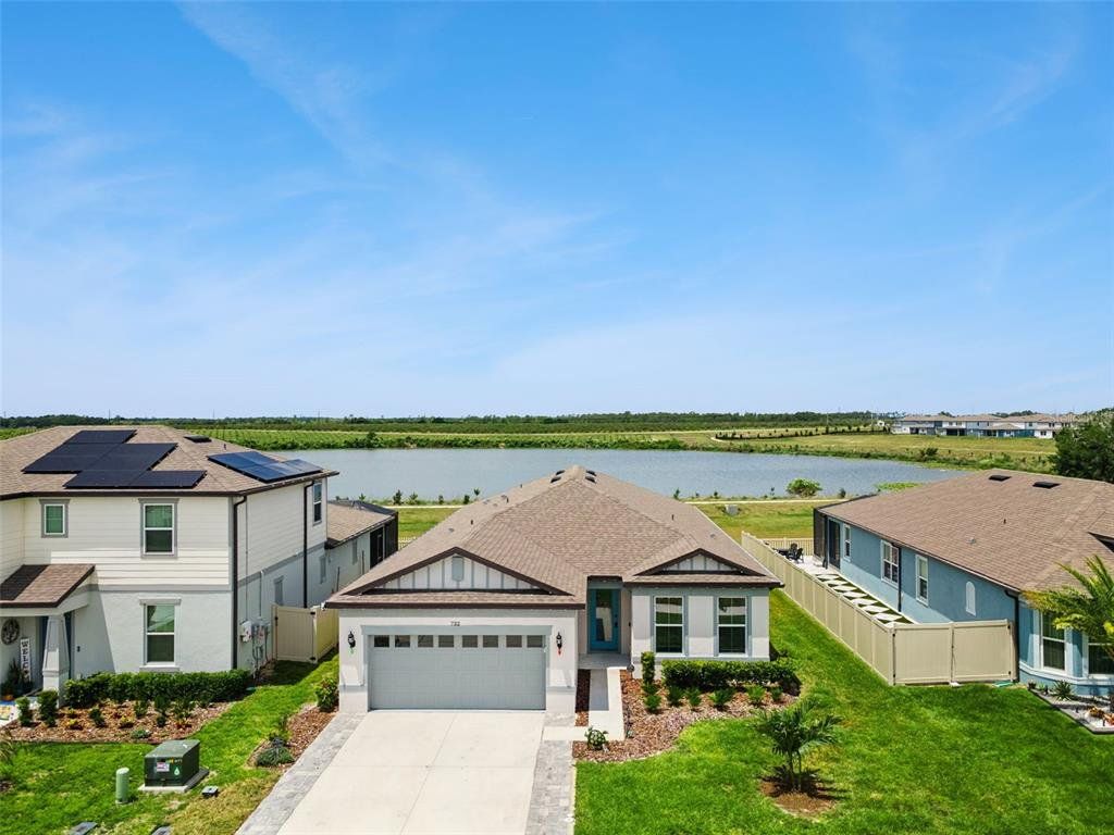 Front exterior of a new home in , Lake Alfred, FL, highlighting curb appeal (Image 1). Front exterior of a new home in , Lake Alfred, FL, highlighting curb appeal (Image 1).