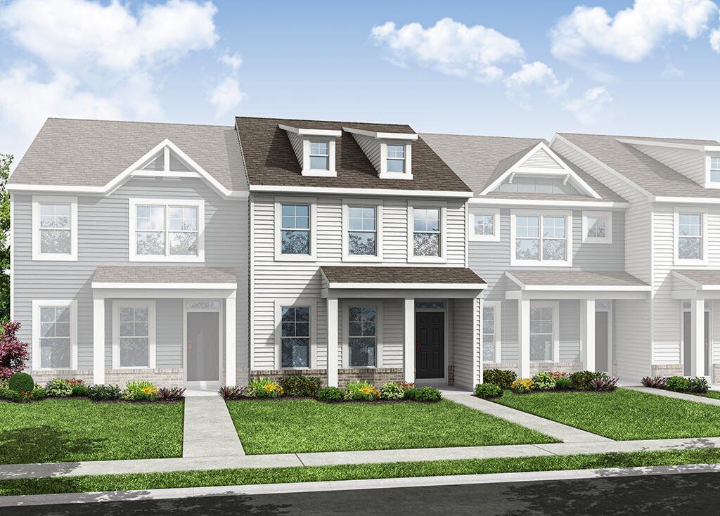 Front exterior of a new home in Enclave at Traditions Townhomes, Wake Forest, NC, highlighting curb appeal (Image 1). Front exterior of a new home in Enclave at Traditions Townhomes, Wake Forest, NC, highlighting curb appeal (Image 1).