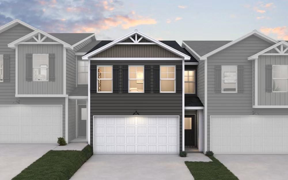 Front exterior of a new home in The Enclave Townhomes, Hampton, GA, highlighting curb appeal (Image 1). Front exterior of a new home in The Enclave Townhomes, Hampton, GA, highlighting curb appeal (Image 1).
