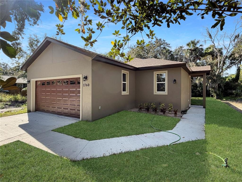 Front exterior of a new home in , Sanford, FL, highlighting curb appeal (Image 1). Front exterior of a new home in , Sanford, FL, highlighting curb appeal (Image 1).