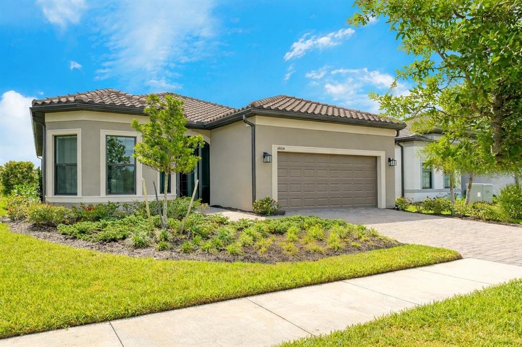 Front exterior of a new home in , Nokomis, FL, highlighting curb appeal (Image 1). Front exterior of a new home in , Nokomis, FL, highlighting curb appeal (Image 1).