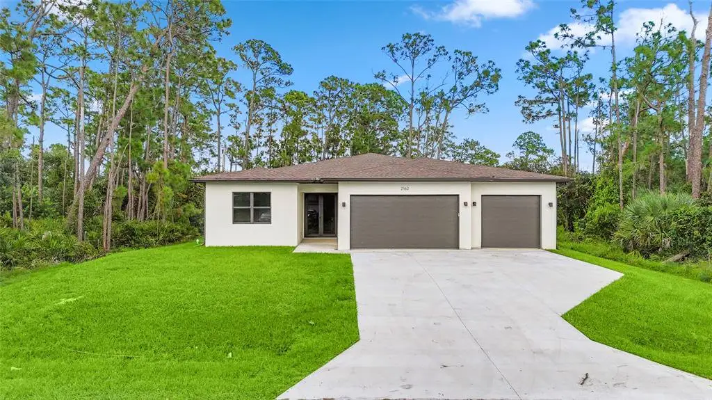 Front exterior of a new home in , Punta Gorda, FL, highlighting curb appeal (Image 1). Front exterior of a new home in , Punta Gorda, FL, highlighting curb appeal (Image 1).