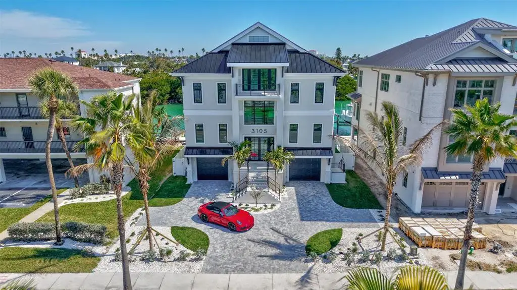 Front exterior of a new home in , St. Pete Beach, FL, highlighting curb appeal (Image 1). Front exterior of a new home in , St. Pete Beach, FL, highlighting curb appeal (Image 1).