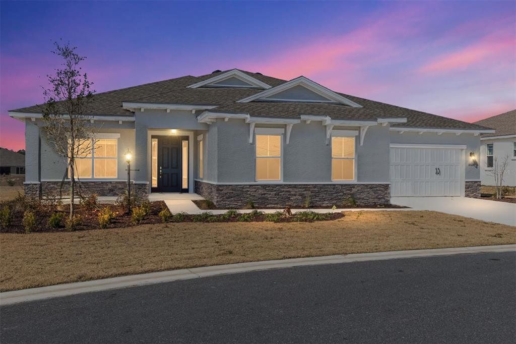 Front exterior of a new home in On Top of the World Communities, Ocala, FL, highlighting curb appeal (Image 1). Front exterior of a new home in On Top of the World Communities, Ocala, FL, highlighting curb appeal (Image 1).