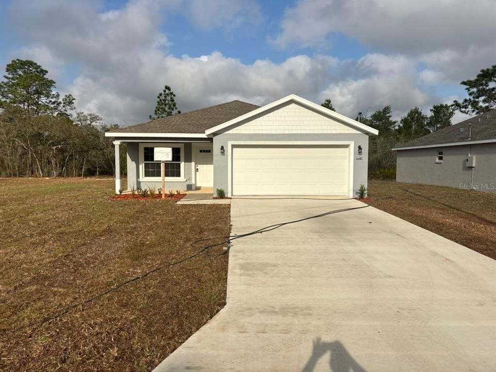 Front exterior of a new home in , Dunnellon, FL, highlighting curb appeal (Image 1). Front exterior of a new home in , Dunnellon, FL, highlighting curb appeal (Image 1).