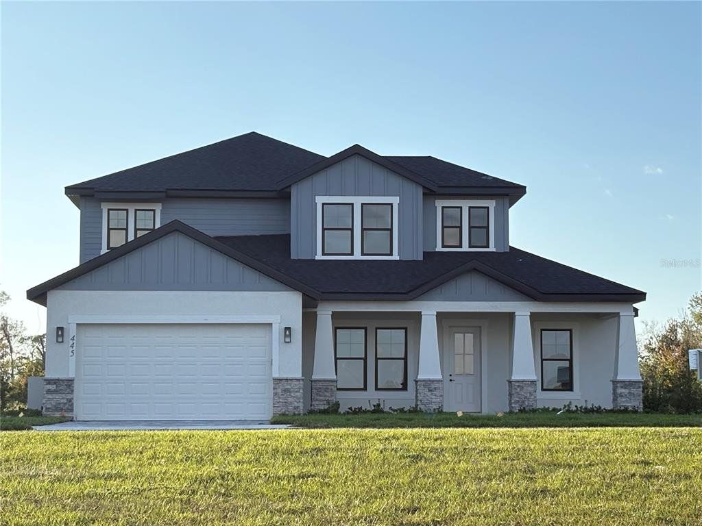 Front exterior of a new home in , Auburndale, FL, highlighting curb appeal (Image 1). Front exterior of a new home in , Auburndale, FL, highlighting curb appeal (Image 1).