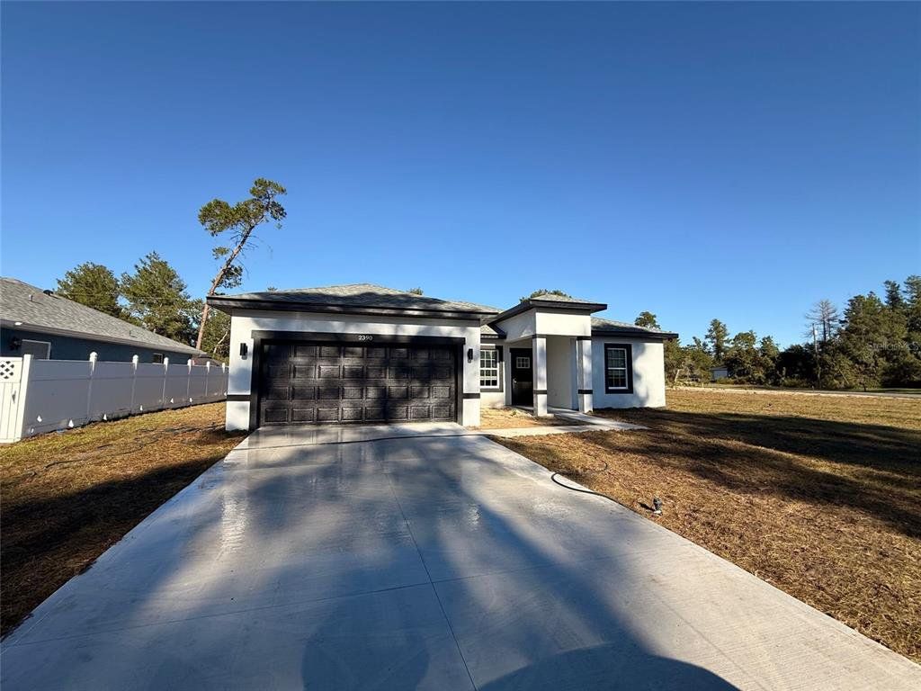 Front exterior of a new home in , Ocala, FL, highlighting curb appeal (Image 1). Front exterior of a new home in , Ocala, FL, highlighting curb appeal (Image 1).