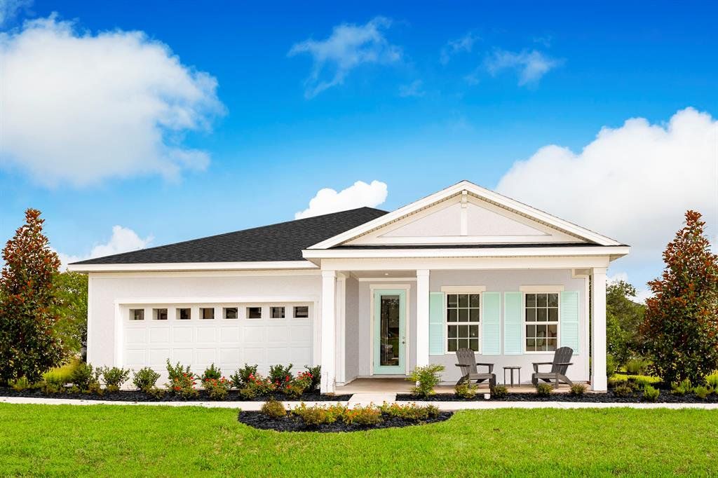 Front exterior of a new home in Overlook at Grassy Lake, Minneola, FL, highlighting curb appeal (Image 1). Front exterior of a new home in Overlook at Grassy Lake, Minneola, FL, highlighting curb appeal (Image 1).