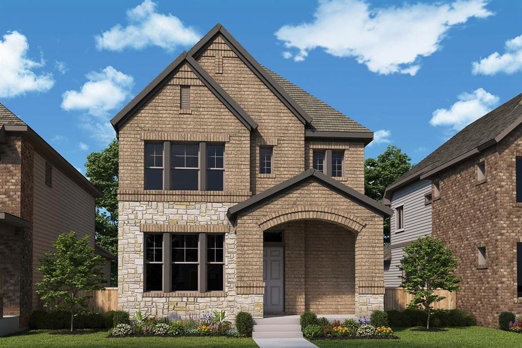 Craftsman-style home with stone siding, brick siding, and a front lawn Craftsman-style home with stone siding, brick siding, and a front lawn
