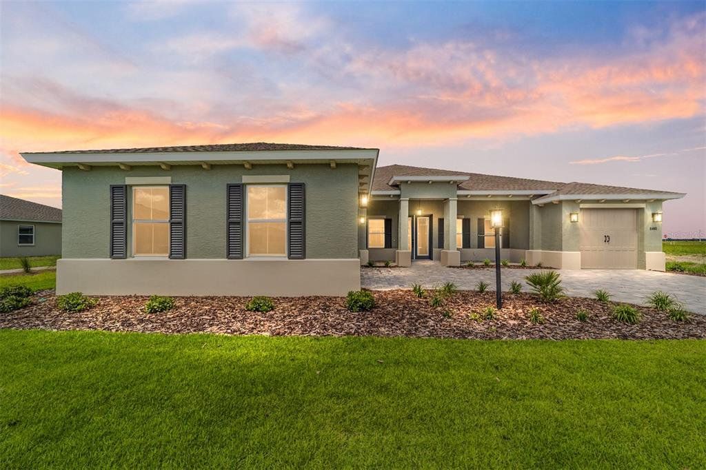 Front exterior of a new home in On Top of the World Communities, Ocala, FL, highlighting curb appeal (Image 1). Front exterior of a new home in On Top of the World Communities, Ocala, FL, highlighting curb appeal (Image 1).